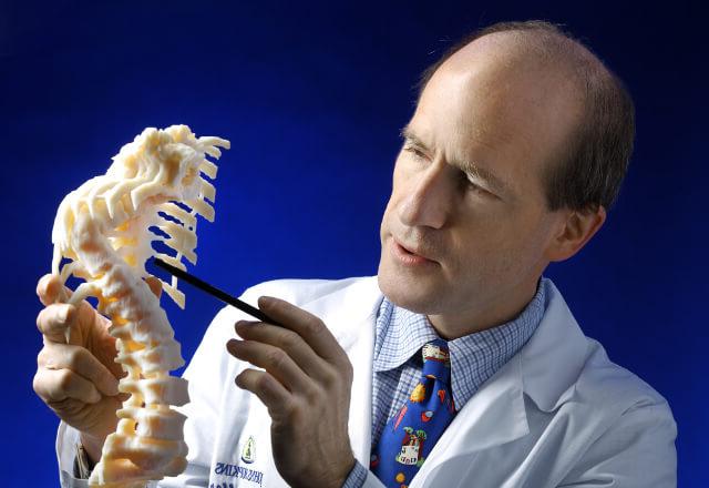Dr. Sponsellor pointing to a model spine